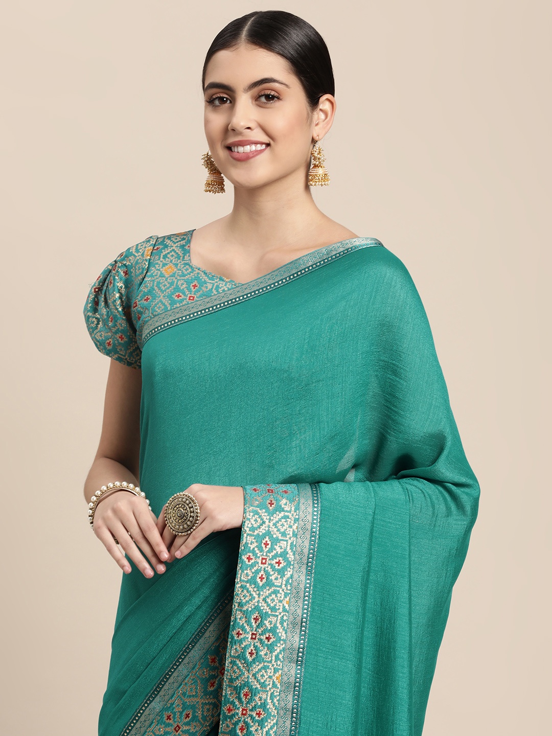 

Mitera Sea Green Solid Saree