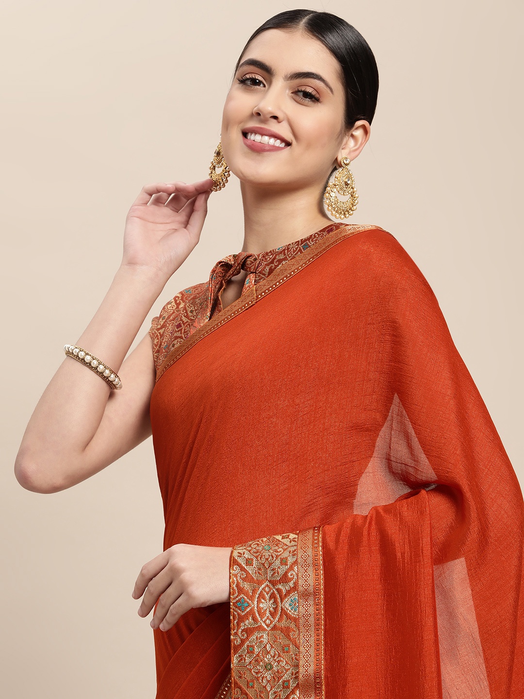 

Mitera Orange Solid Saree