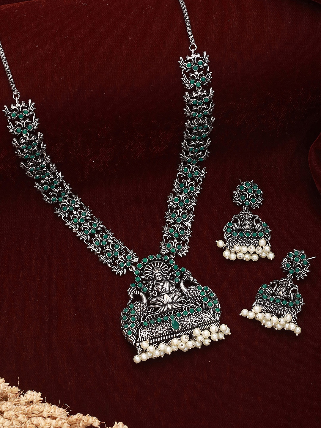 

Saraf RS Jewellery Oxidised Silver-Toned & Green Stone-Studded & Beaded Jewellery Set