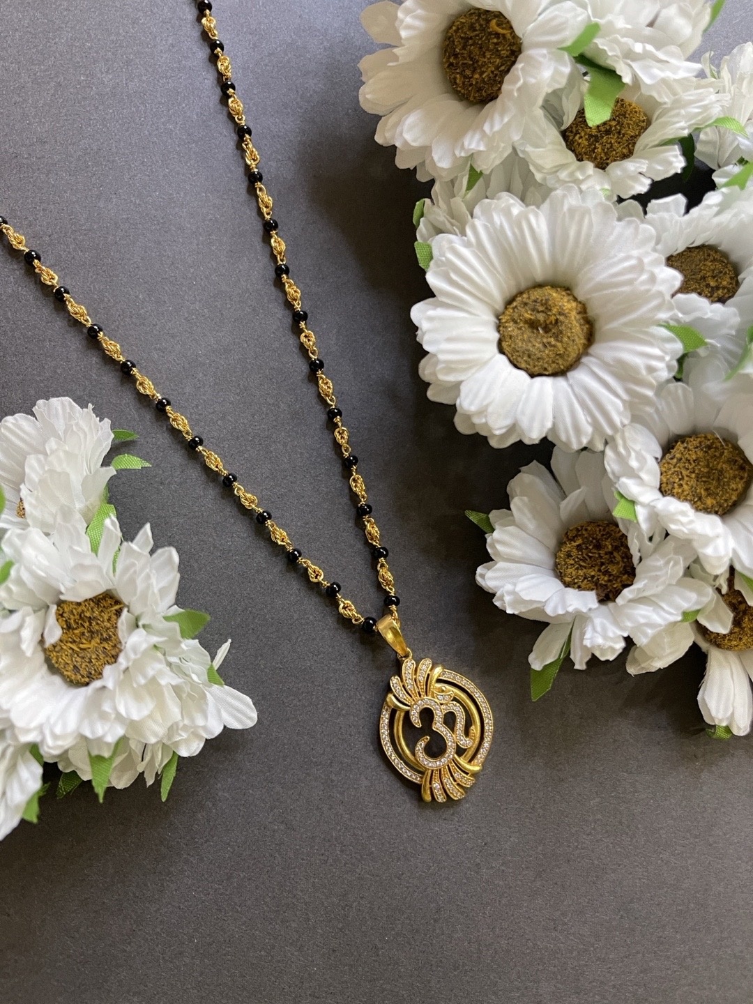 

Digital Dress Room Gold-Plated AD-Studded Om Mangalsutra