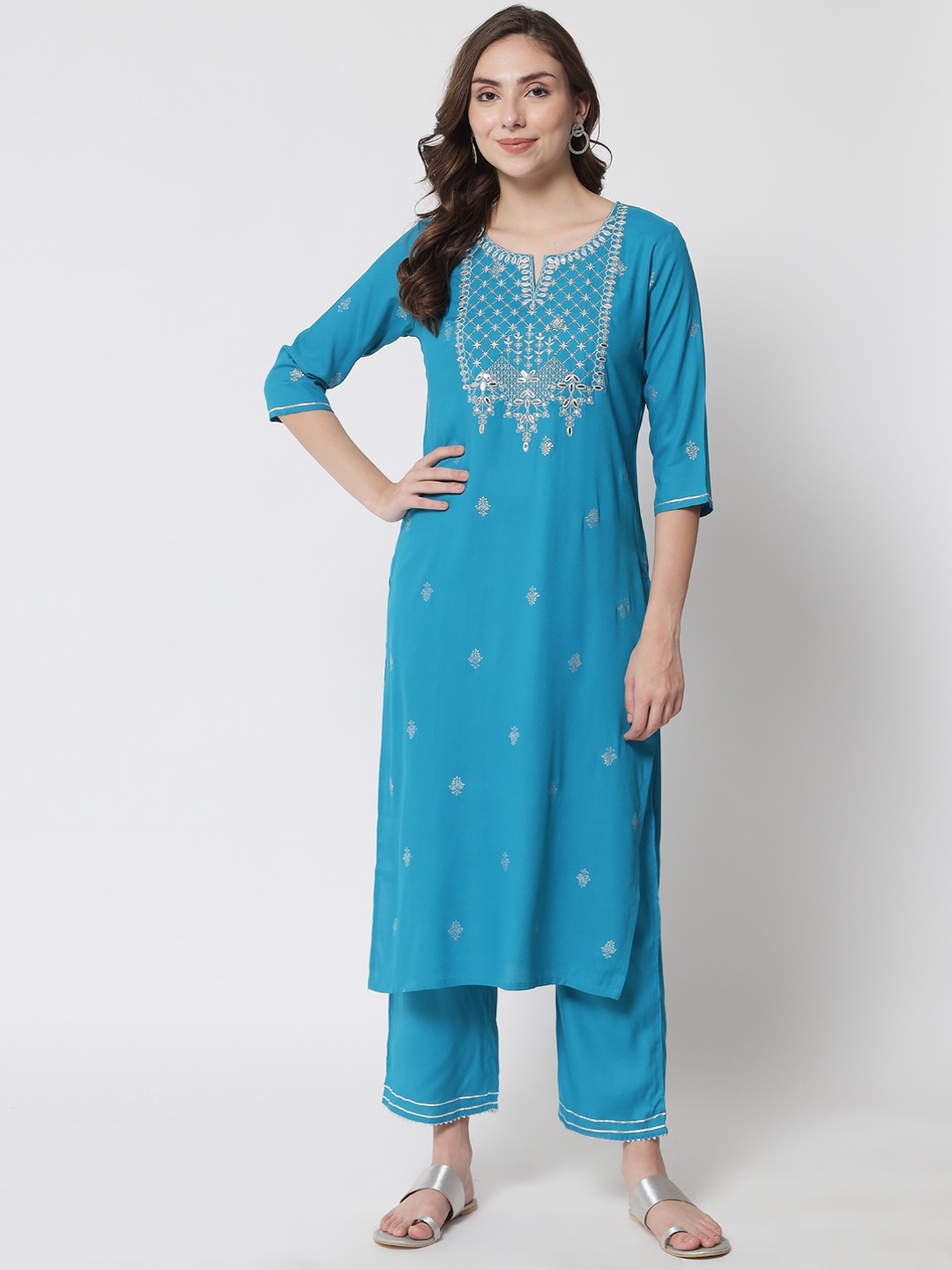 

Meeranshi Women Blue Embroidered Kurta with Trousers