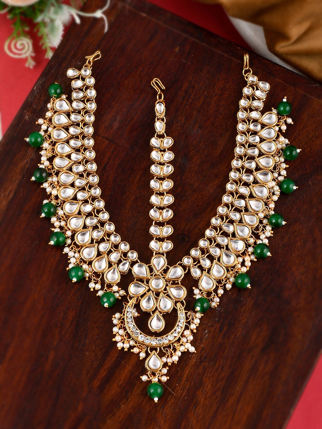 

Shoshaa Women Green & White Gold-Plated Kundan Studded Matha Patti