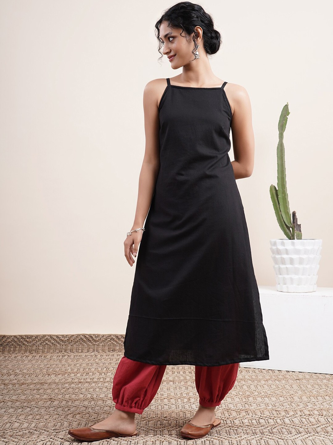 

Abhishti Women Black Embroidered Kurti with Churidar