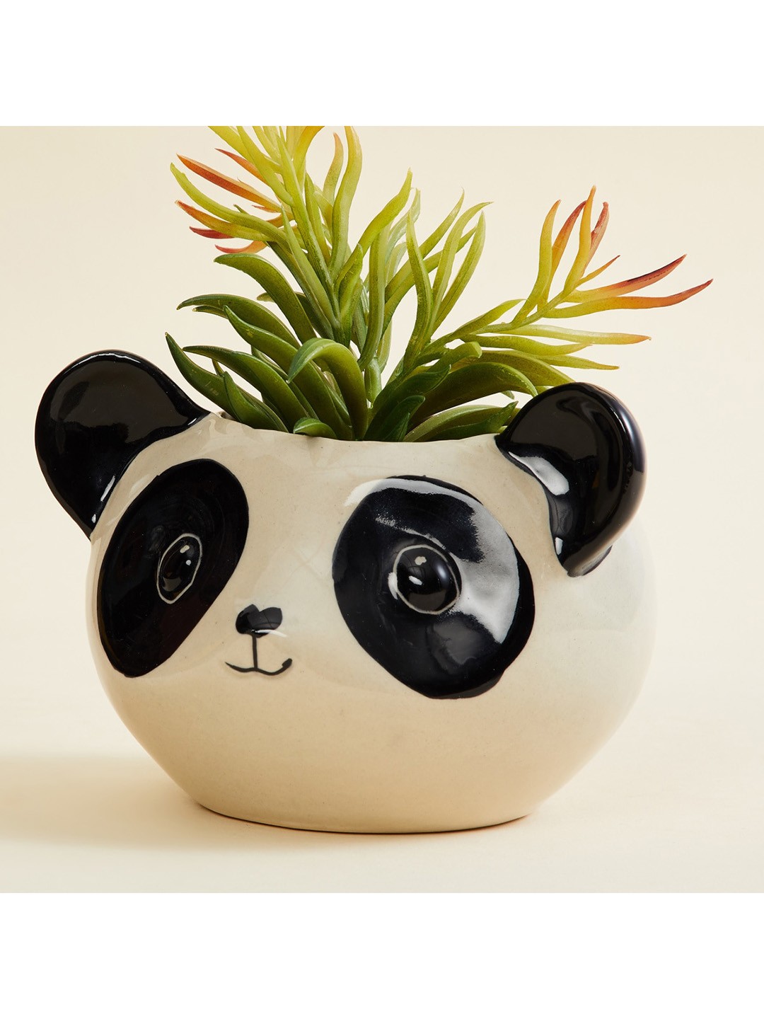 

Home Centre Beige & Black Colourblocked Panda Ceramic Planter