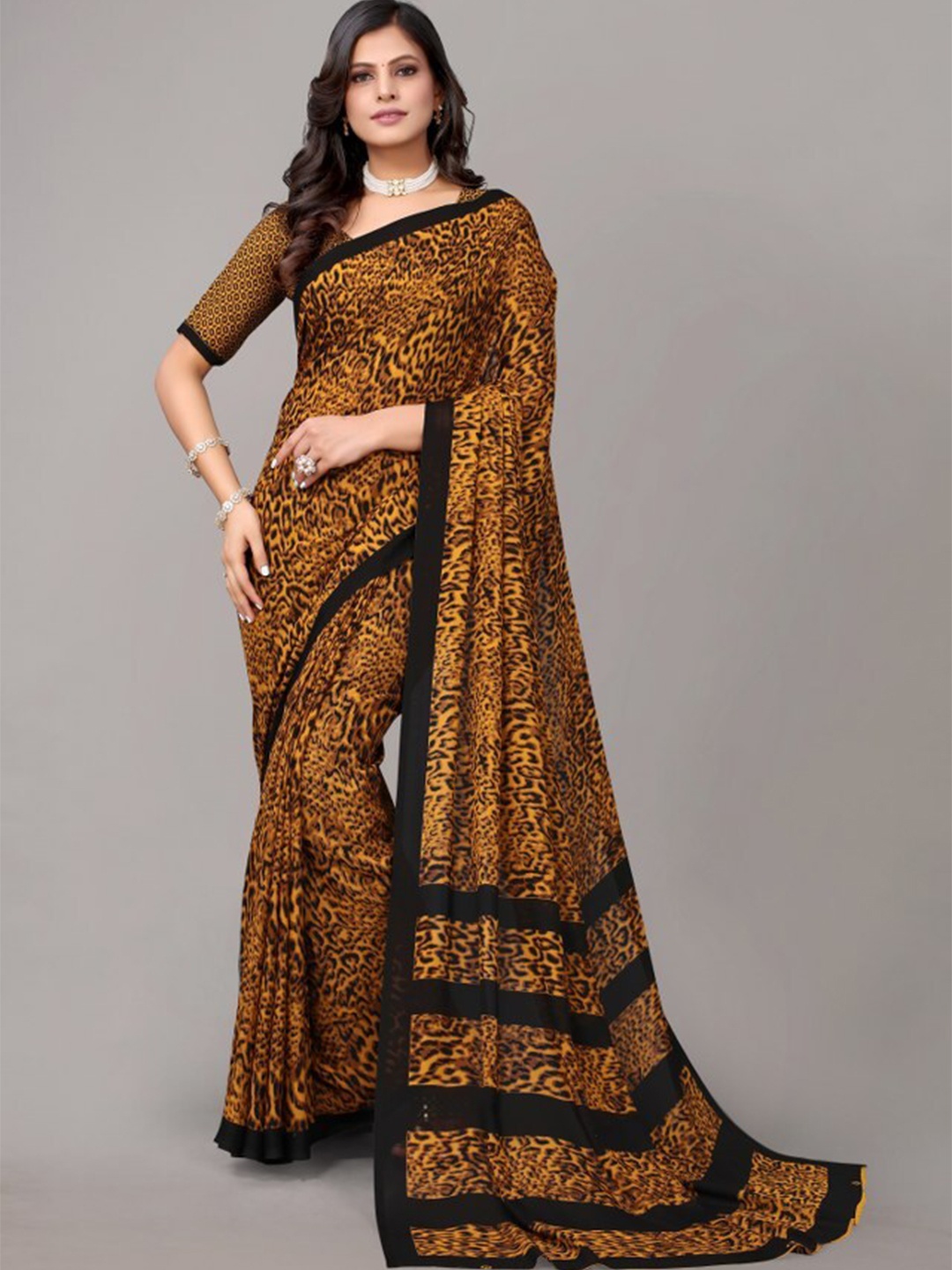 

Yashika Black & Brown Animal Printed Saree