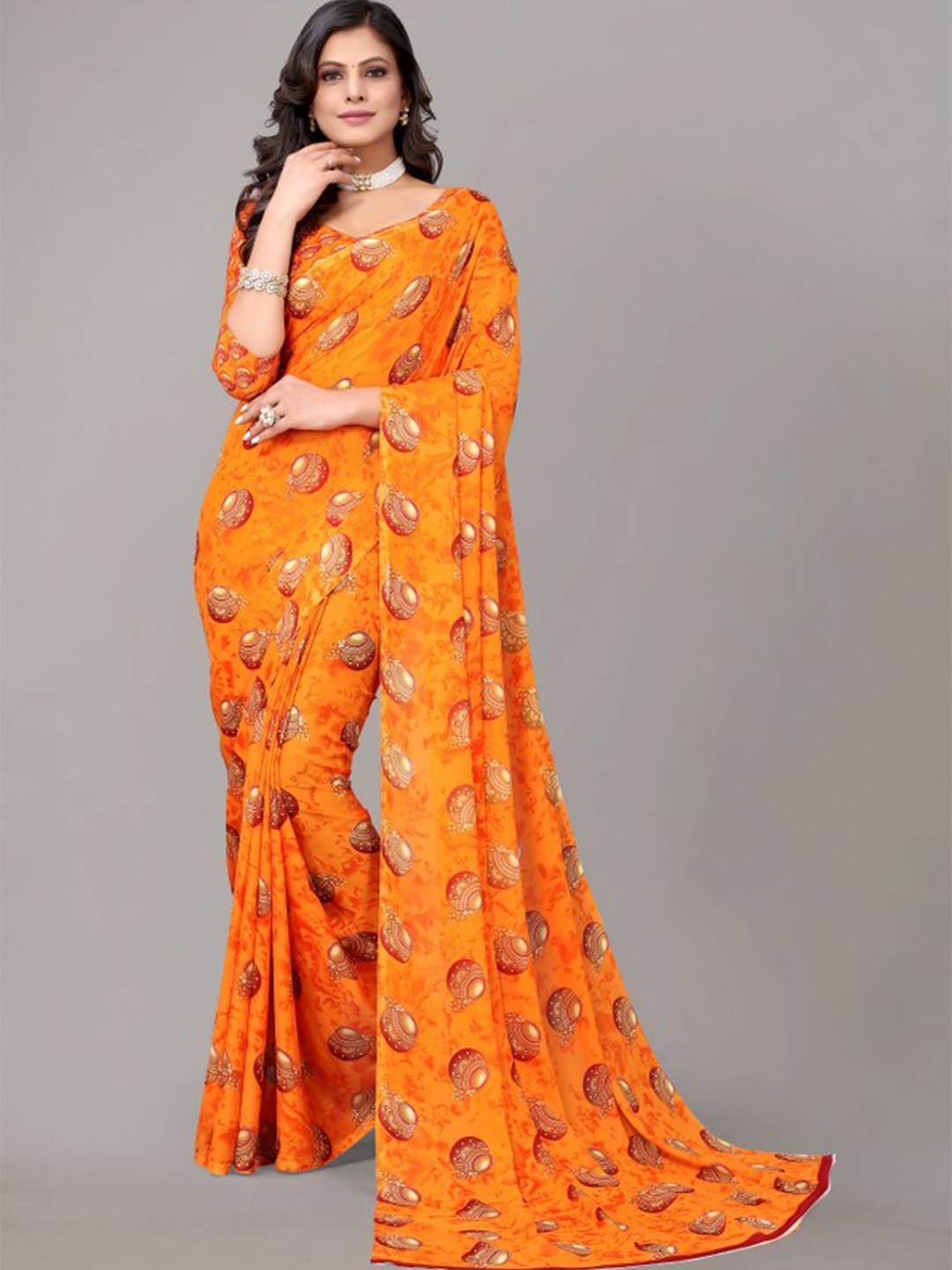 

Yashika Orange & Gold-Toned Ethnic Motifs Printed Georgette Saree