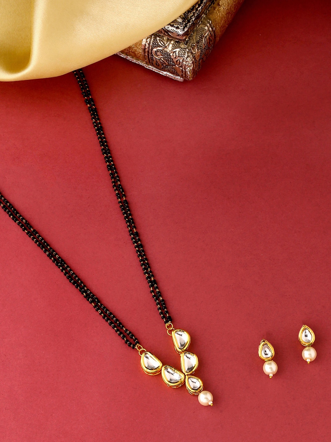 

VIRAASI Women White & Black Gold-Plated Kundan-Studded Mangalsutra with Earrings