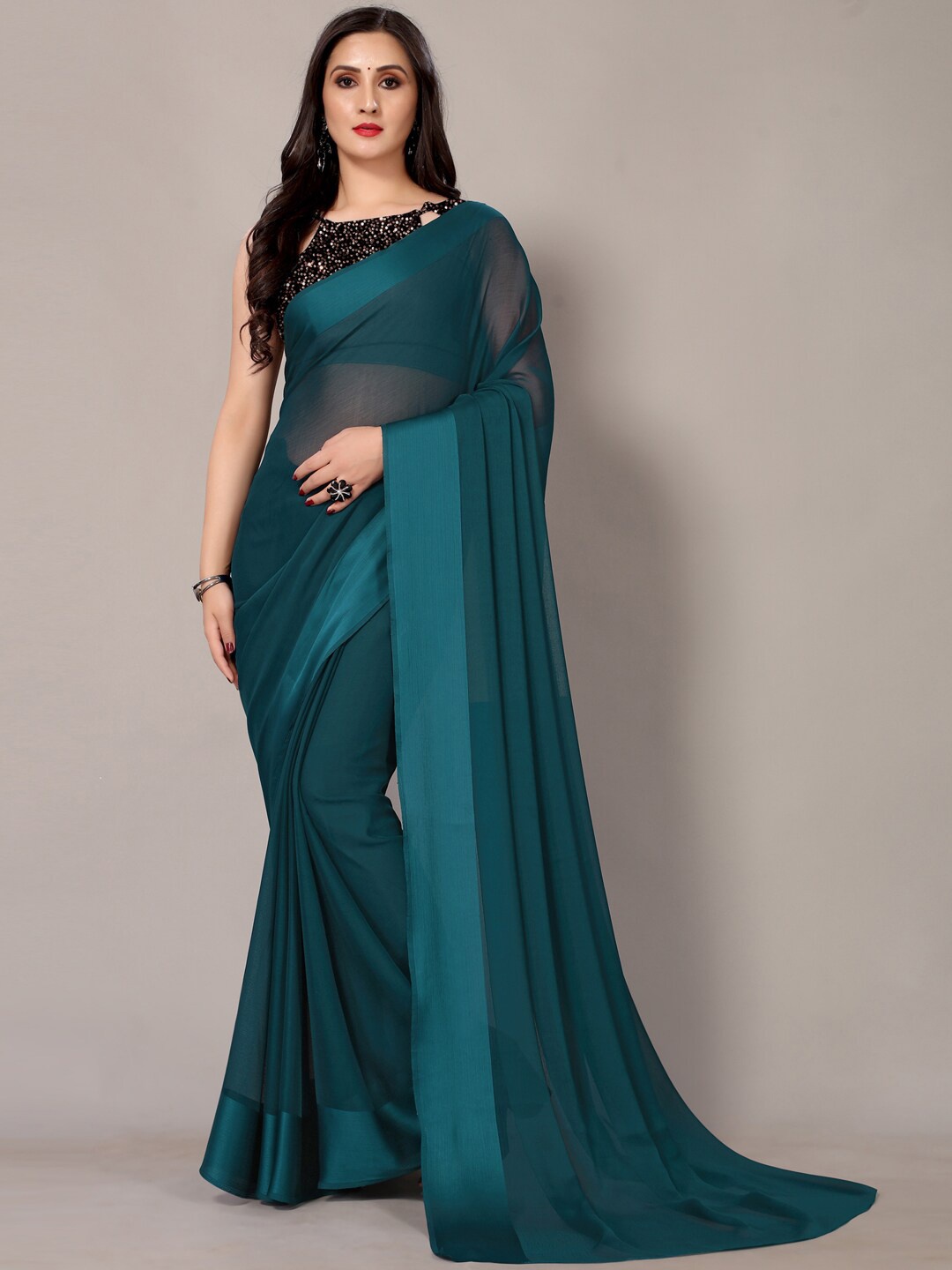 

HRITIKA Teal Solid Embellished Polly Chiffon Designer Saree
