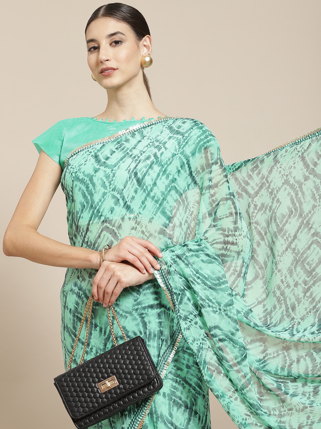 

Satrani Turquoise Blue Printed Saree