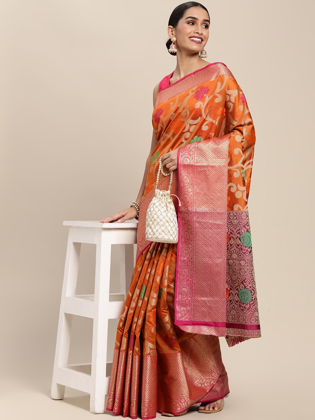 

Mitera Orange & Golden Ethnic Motifs Zari Silk Blend Kanjeevaram Saree