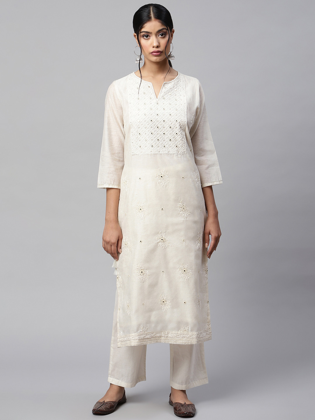 

Readiprint Fashions Women Off White Cotton Floral Embroidered Mirror Work Kurta & Palazzos