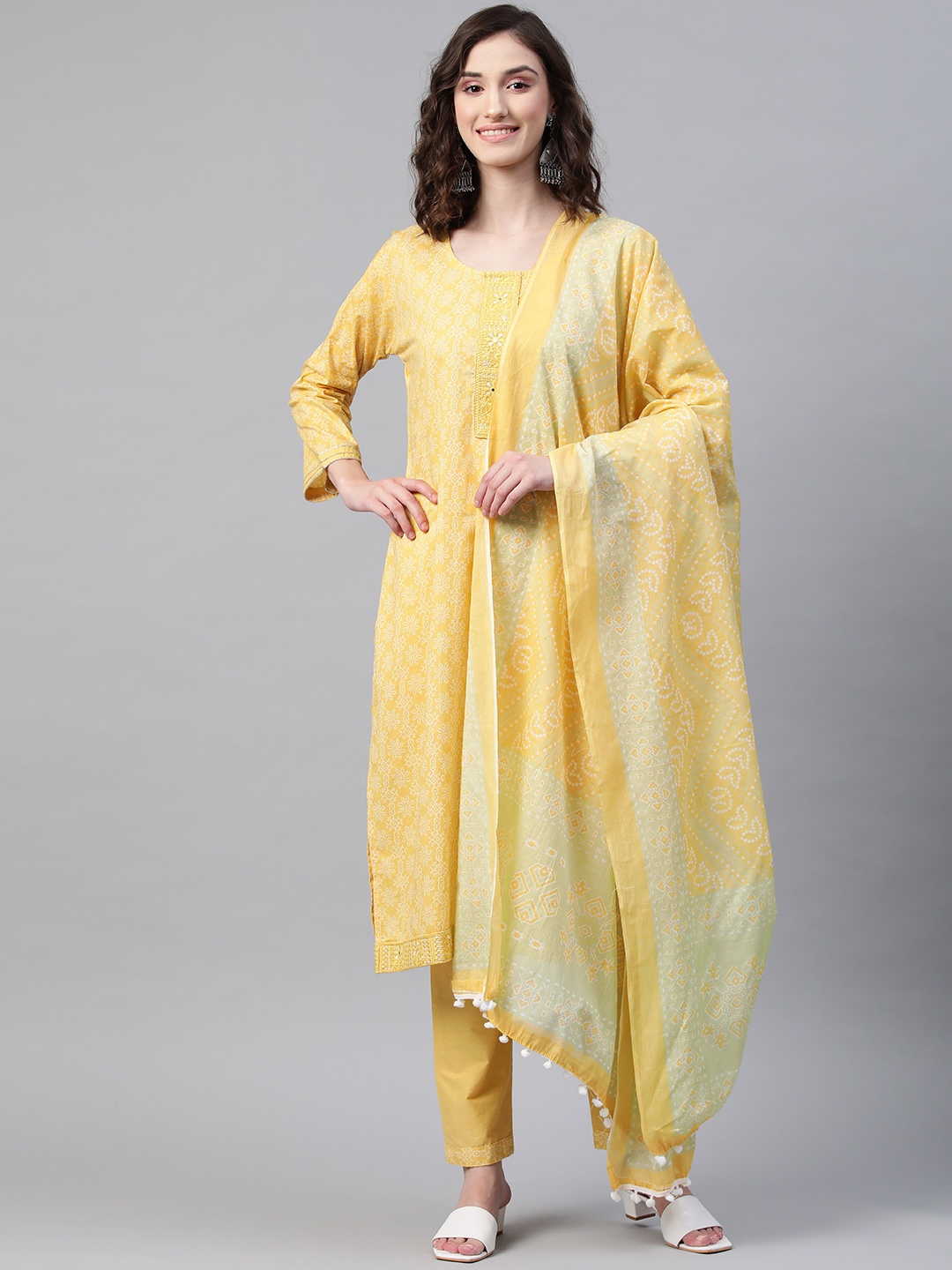 

Readiprint Fashions Women Yellow & Off-White Cotton Bandhani Kurta with Trousers & Dupatta