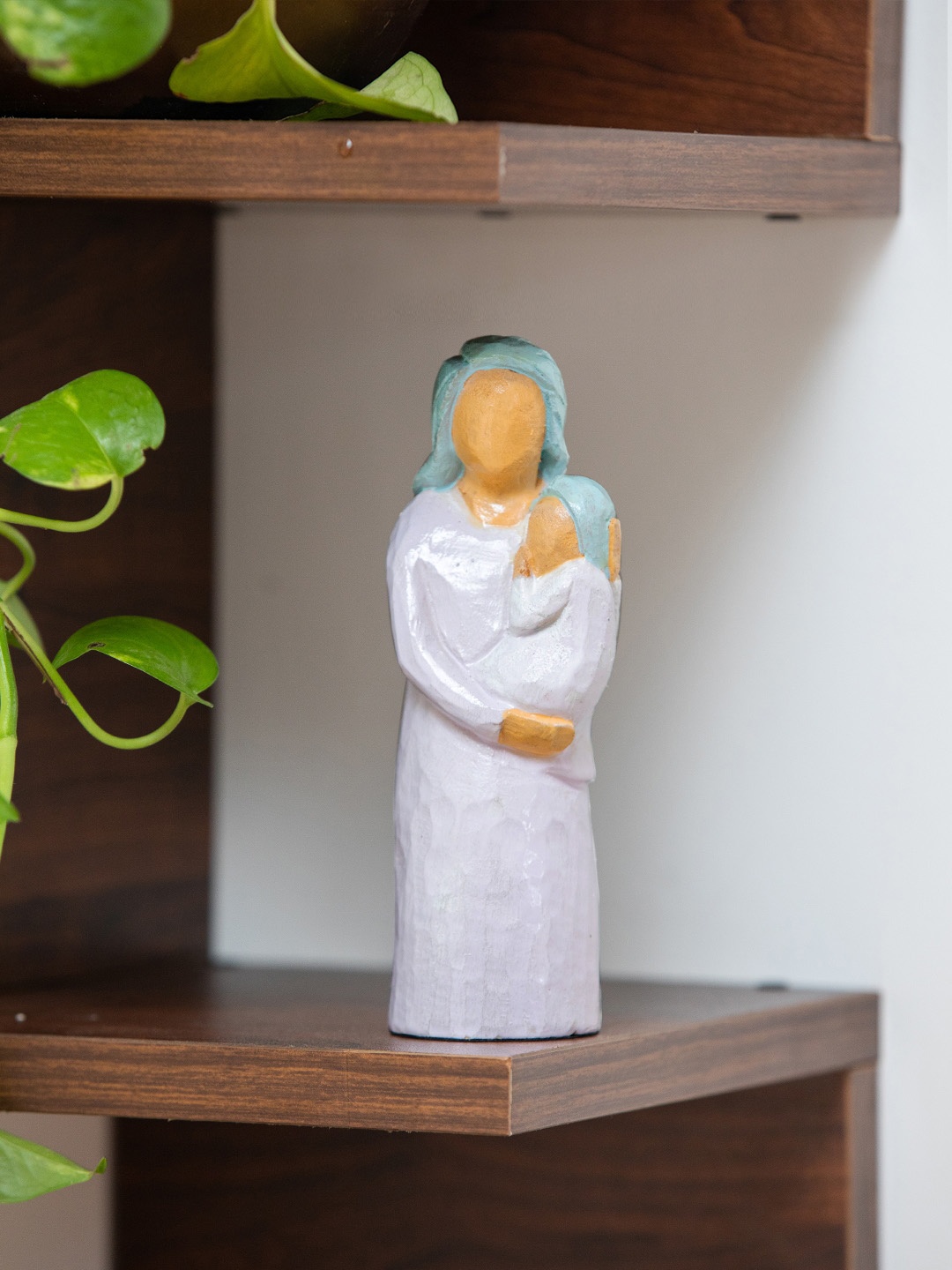 

ExclusiveLane White & Yellow Pure Love Wooden Figurine Showpiece