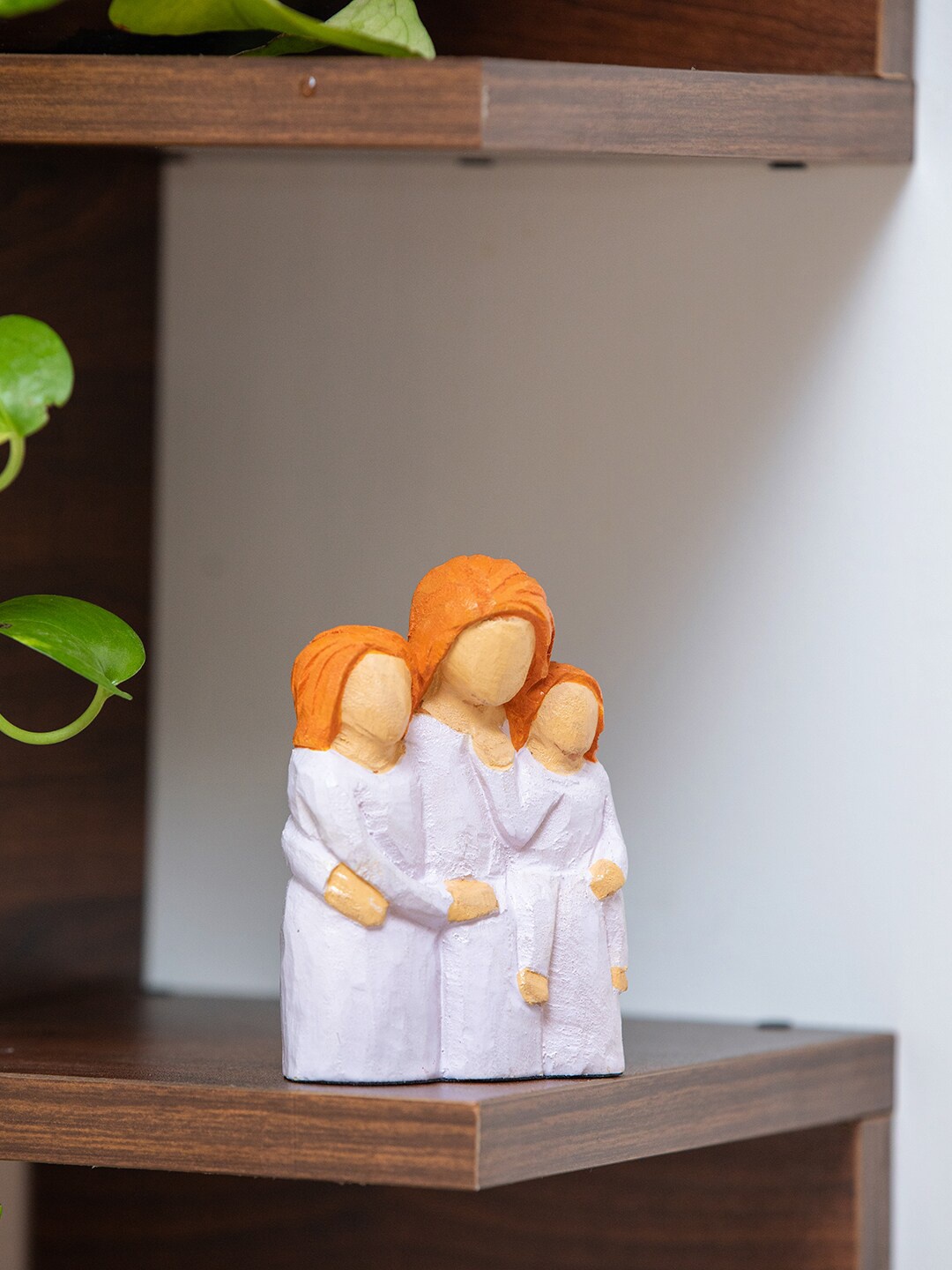 

ExclusiveLane White & Orange Wooden Figurine Showpiece
