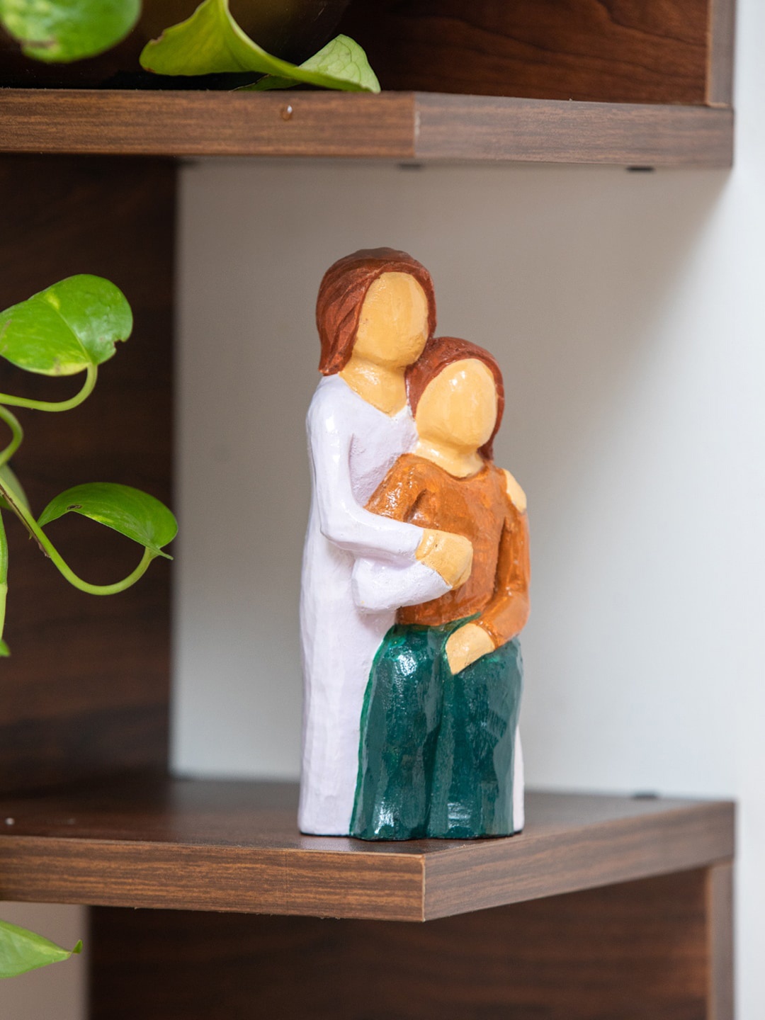 

ExclusiveLane White & Brown Love Above All Handpainted Figurine Showpieces