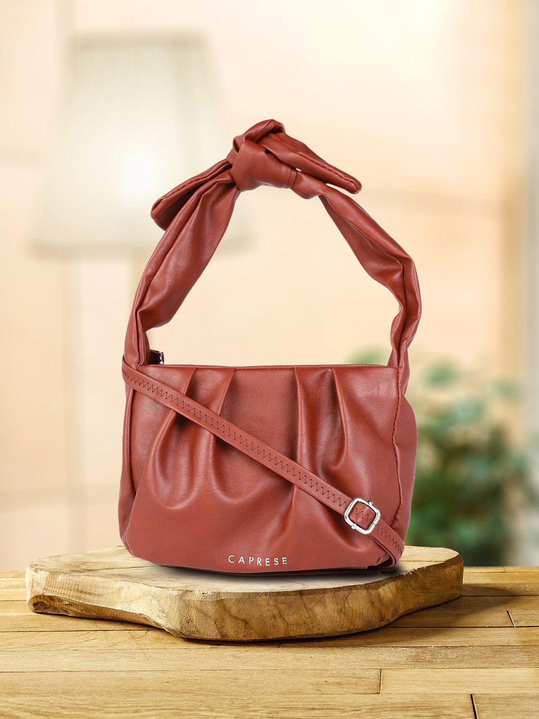 

Caprese Rust Structured Handheld Bag