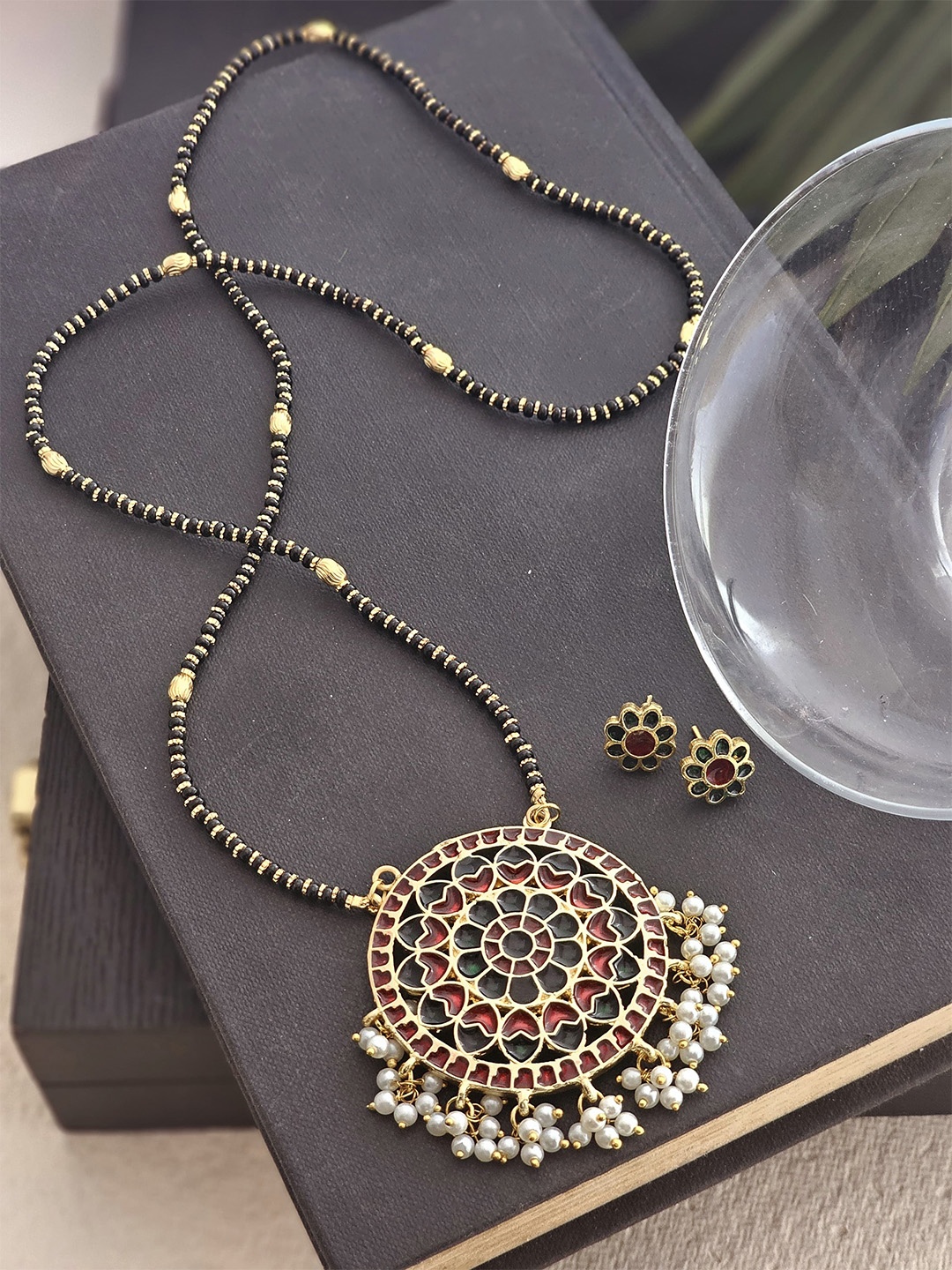 

Binnis Wardrobe Gold Plated Black Beaded Red & Green Stone Studded Mangalsutra
