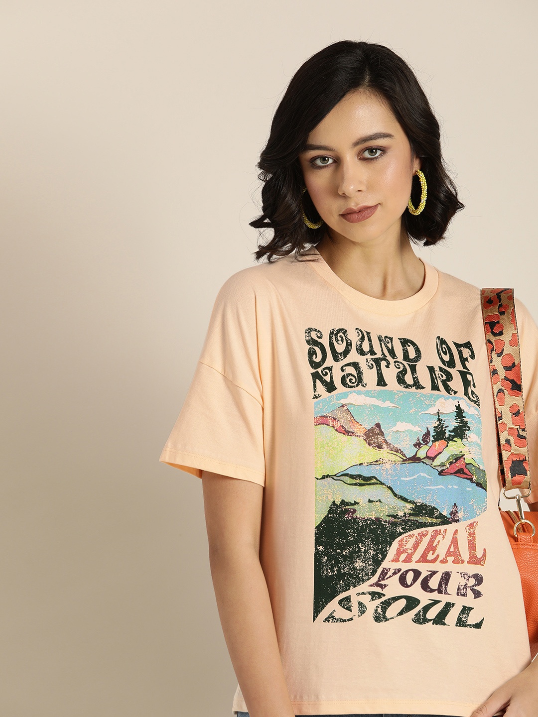 

Moda Rapido Women Peach-Coloured Printed Drop-Shoulder Sleeves Pure Cotton T-shirt