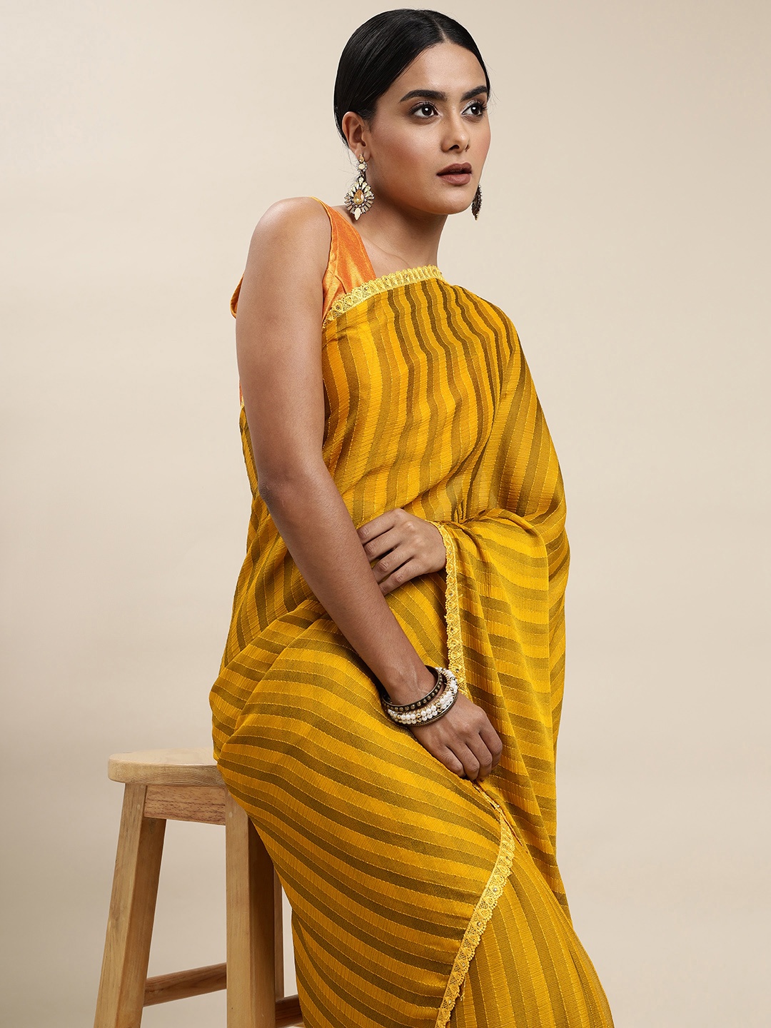 

Shaily Mustard Yellow Striped Sequinned Pure Chiffon Saree
