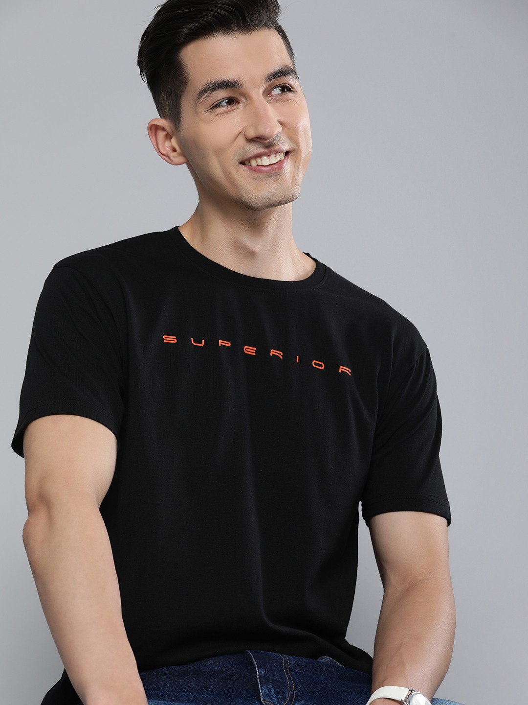 

HERE&NOW Men Black & Orange Typography Printed Slim Fit Pure Cotton Casual T-shirt