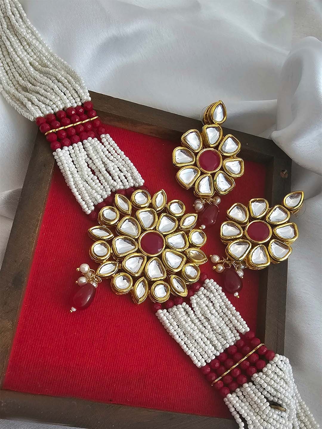 

Binnis Wardrobe Gold-Plated Red Kundan-Studded & Pearl Beaded Jewellery Set