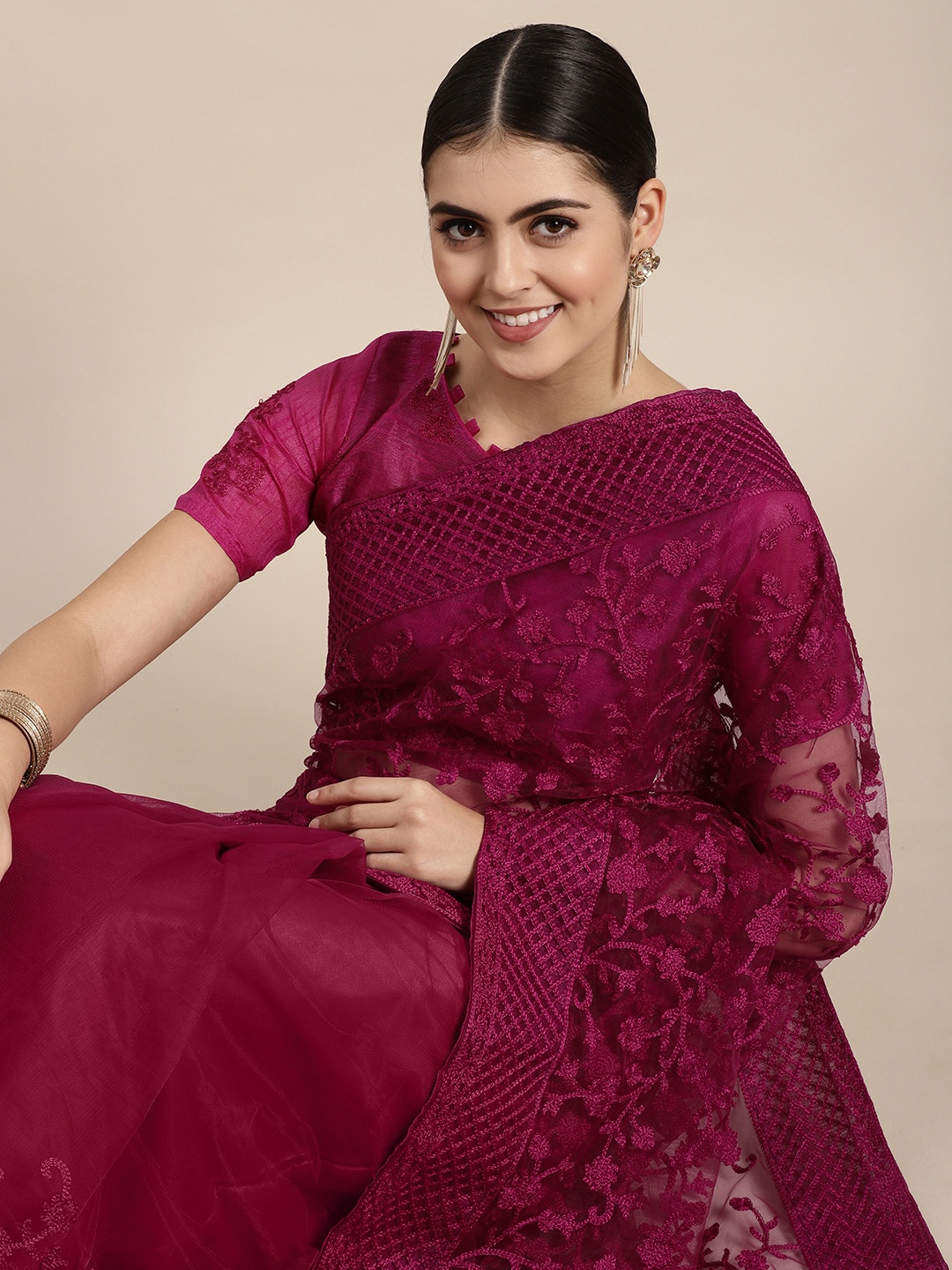 

VAIRAGEE Magenta Floral Embroidered Net Saree