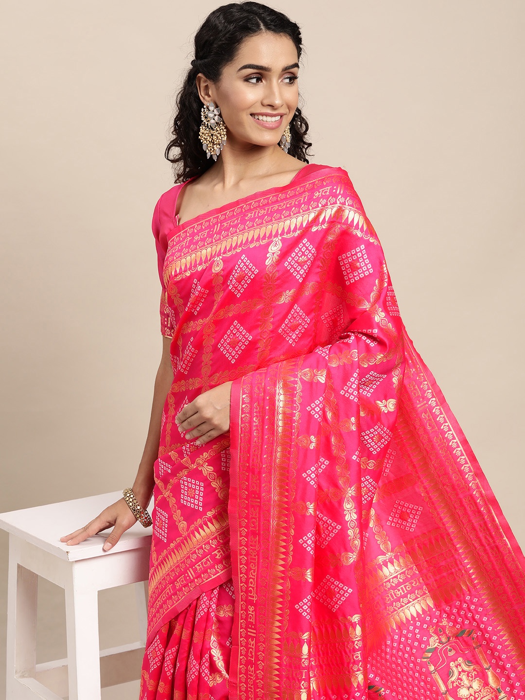 

VAIRAGEE Pink & Golden Ethnic Motifs Saree