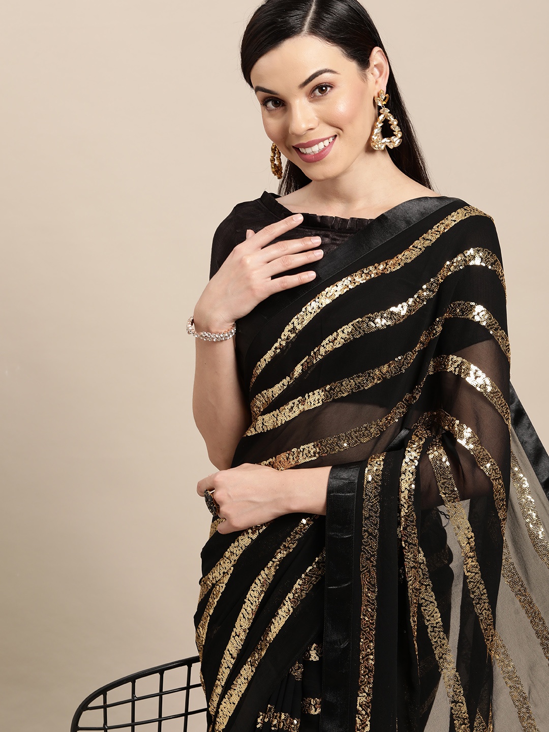 

VAIRAGEE Black & Gold-Toned Striped Sequinned Pure Georgette Saree