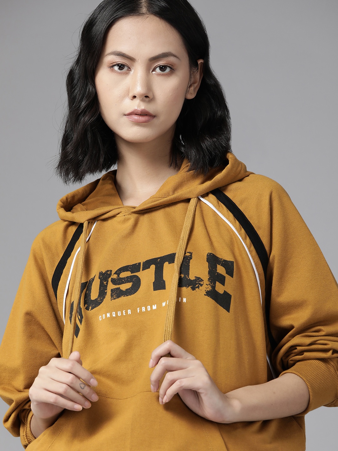 

The Roadster Lifestyle Co. Women Mustard Brown Typography Printed Hooded Sweatshirt