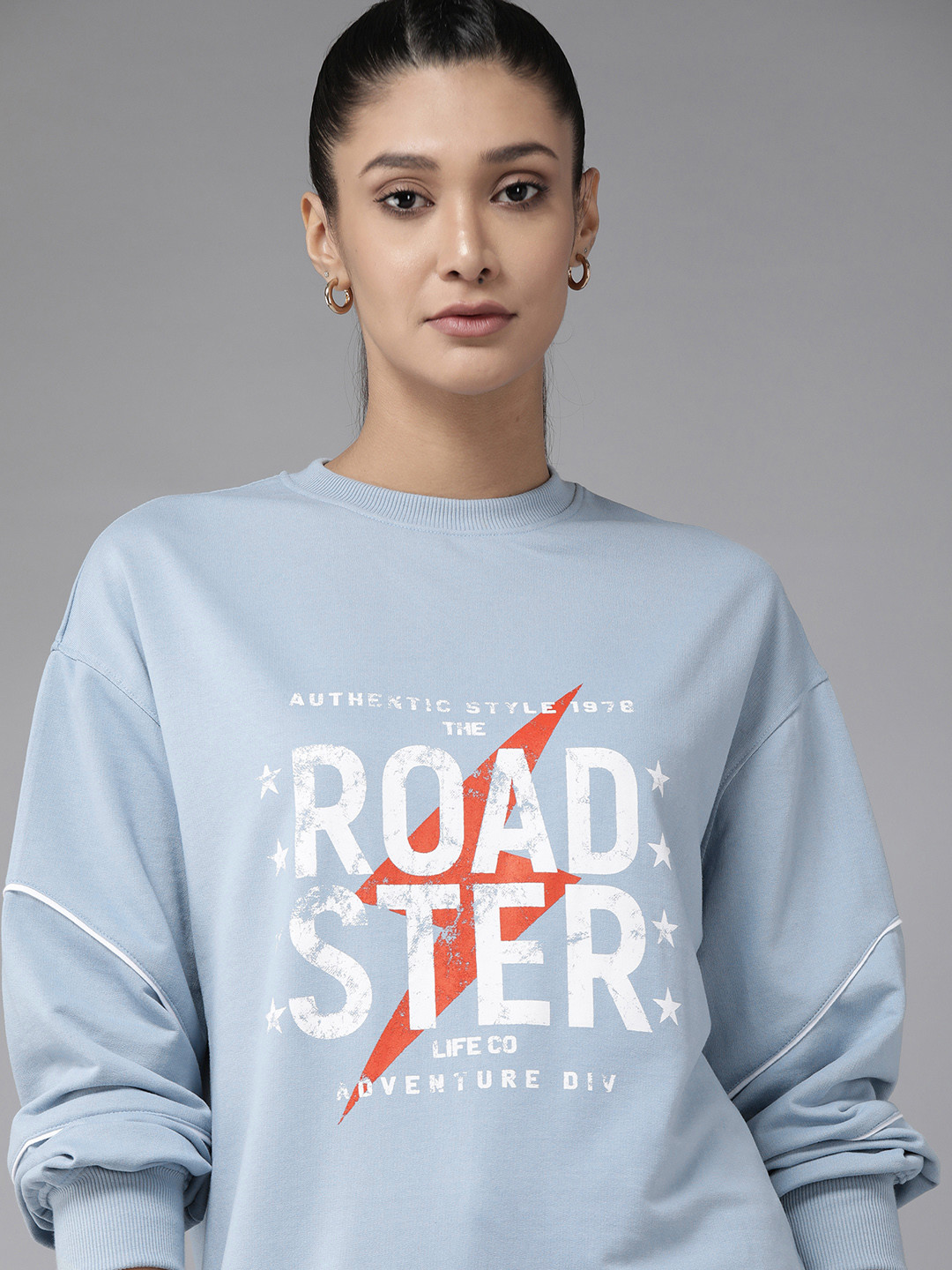 

Roadster Women Blue Typography Printed Longline Sweatshirt