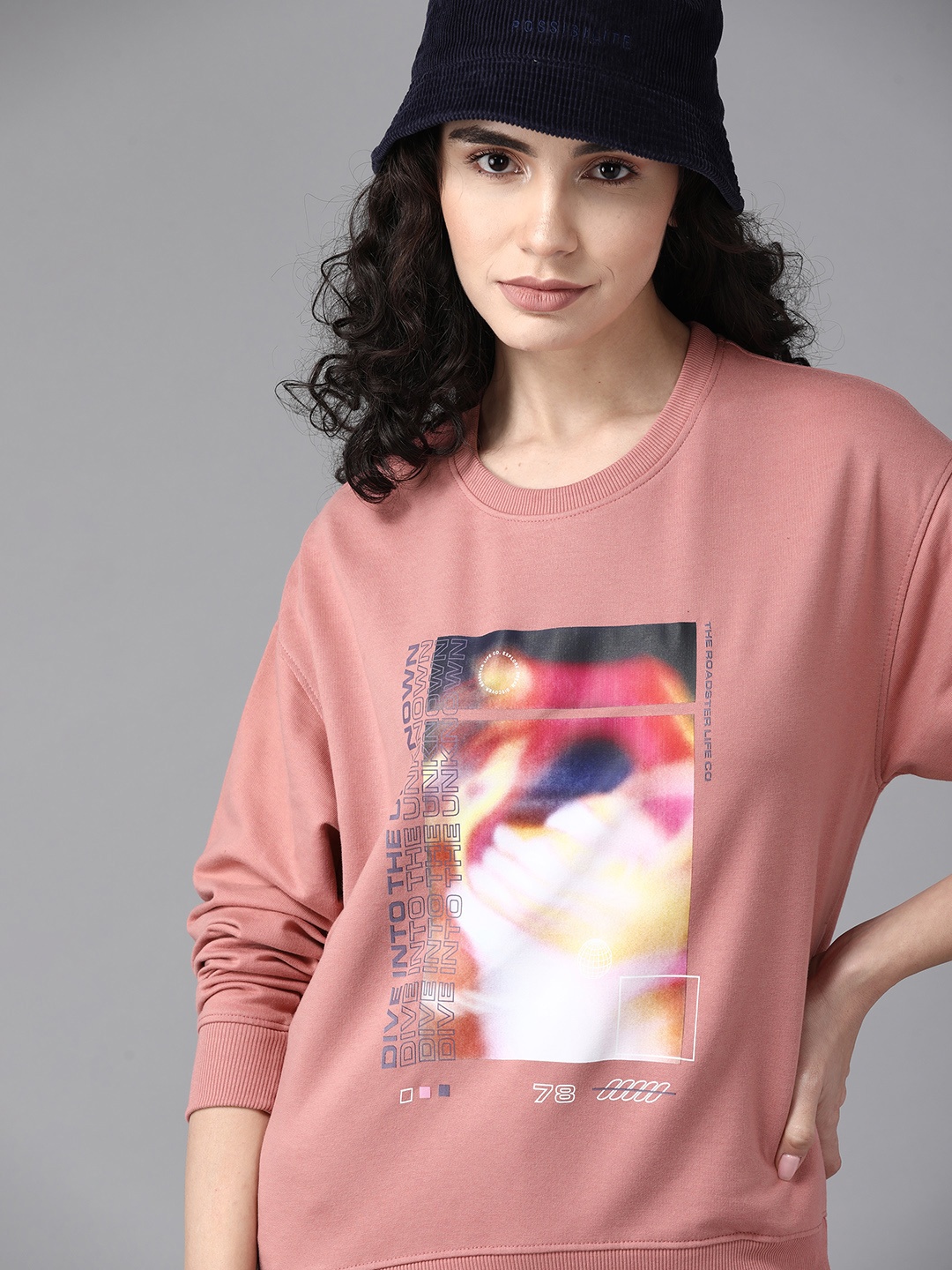 

The Roadster Lifestyle Co. Women Peach-Coloured & White Graphic Printed Sweatshirt