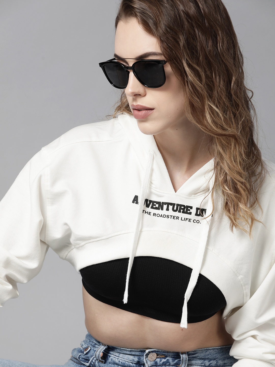 

Roadster Women Off-White Printed Hooded Cropped Sweatshirt