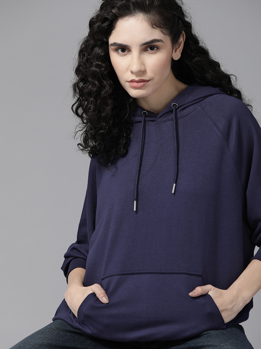 

Roadster Women Navy Blue Solid Hooded Sweatshirt