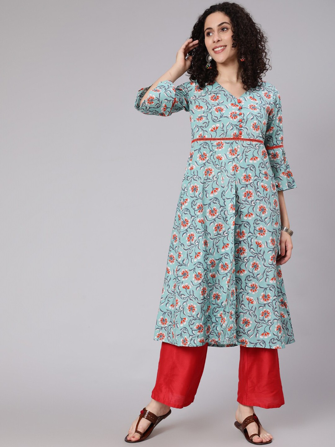 

Awadhi Women Blue Floral Printed Empire Kurta with Palazzos