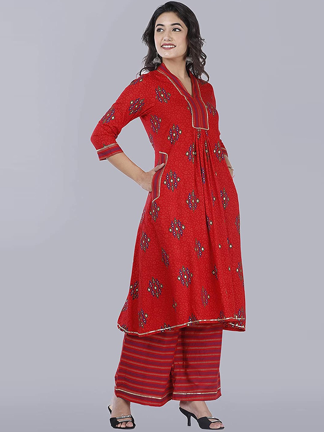 

Sajke Women Red Embroidered Pleated Kurta with Palazzos