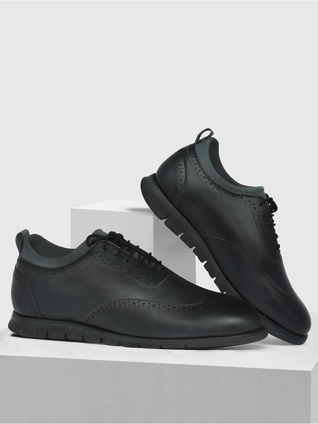 

Ajanta Men Black Perforations Brogues