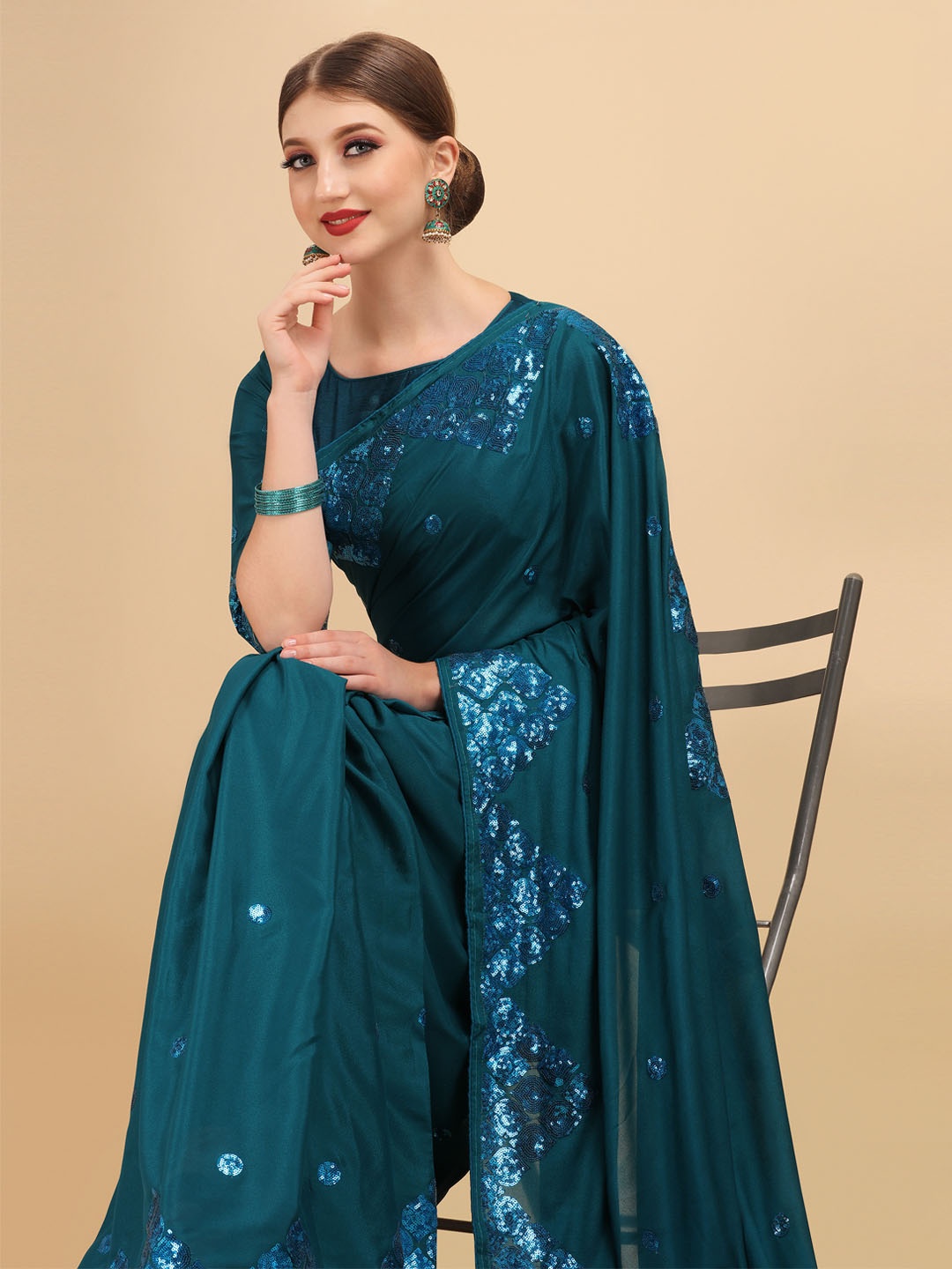 

Sangria Teal Embellished Sequinned Silk Blend Saree