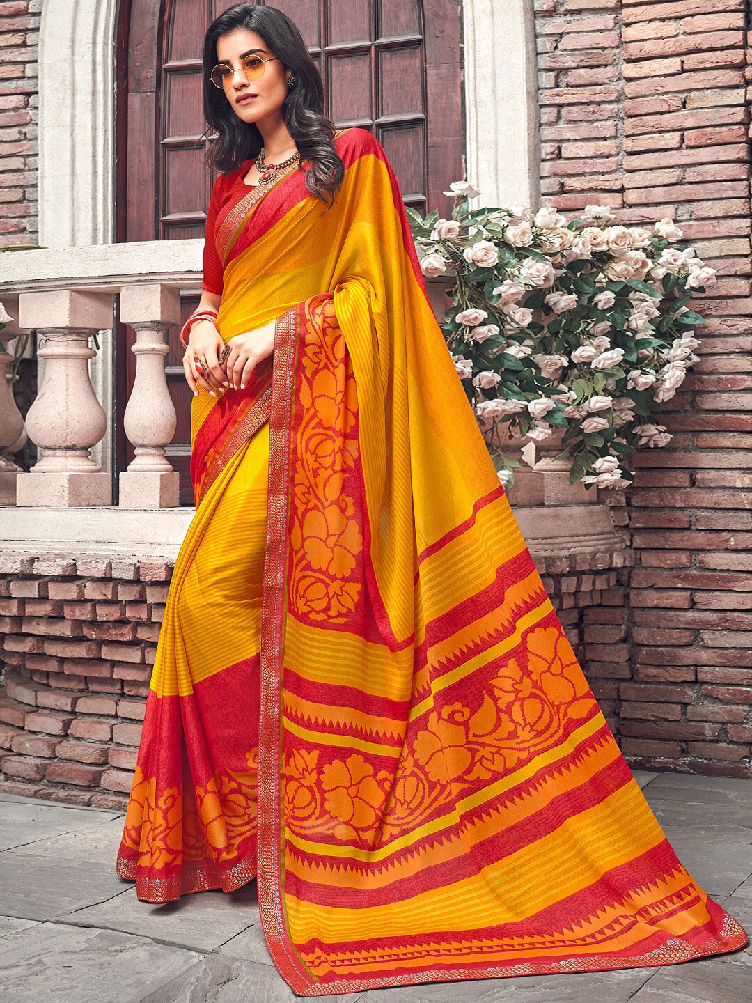 

Shaily Orange & Red Ethnic Motifs Saree