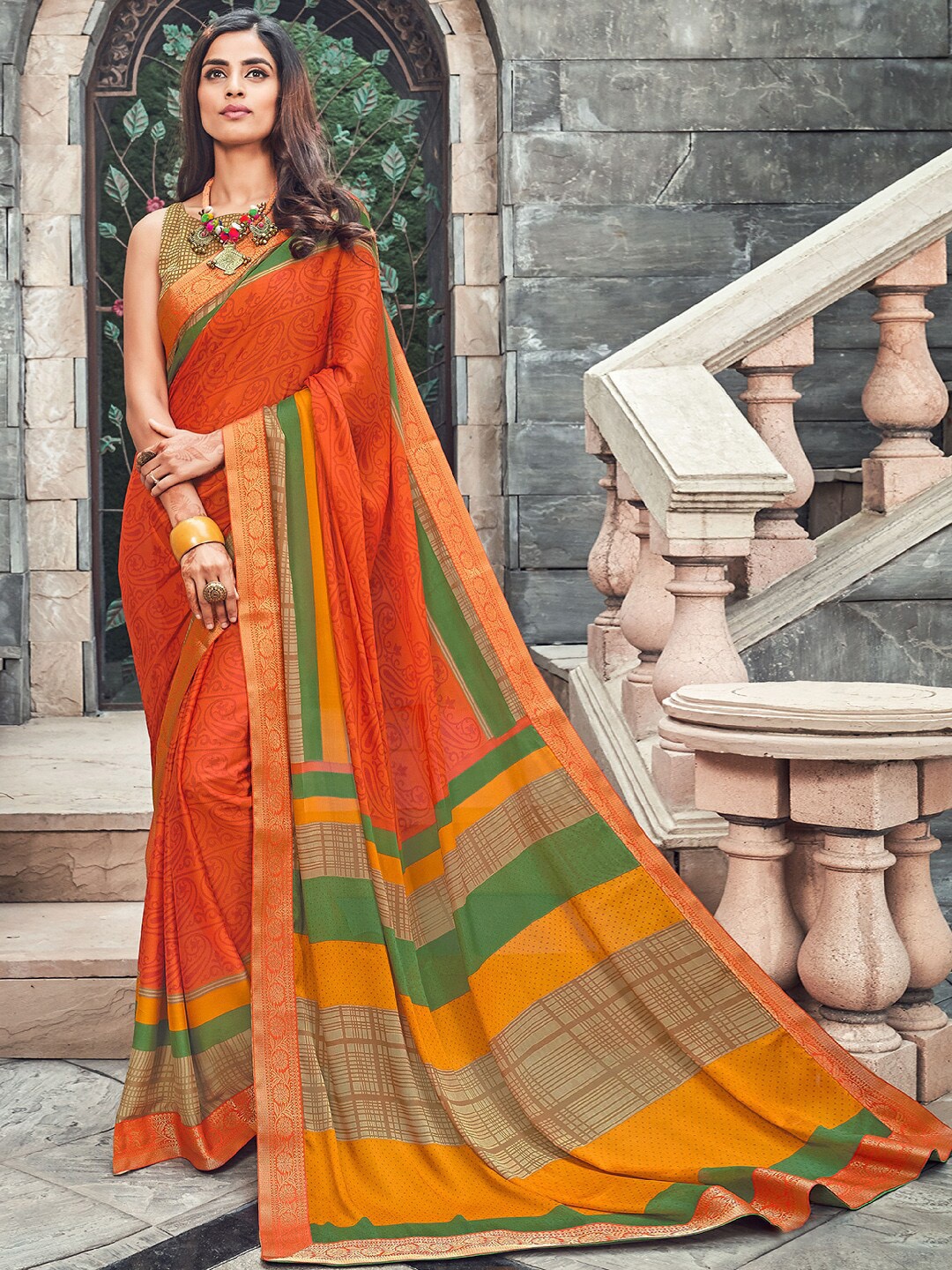 

Shaily Orange & Green Ethnic Motifs Saree