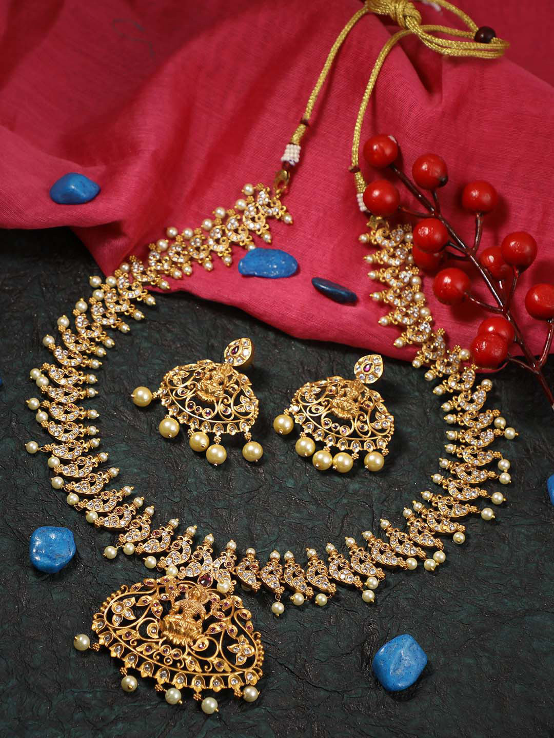 

Adwitiya Collection 24CT Gold-Plated White Stones-Studded Temple Peacock Shaped Antique Long Jewellery Set