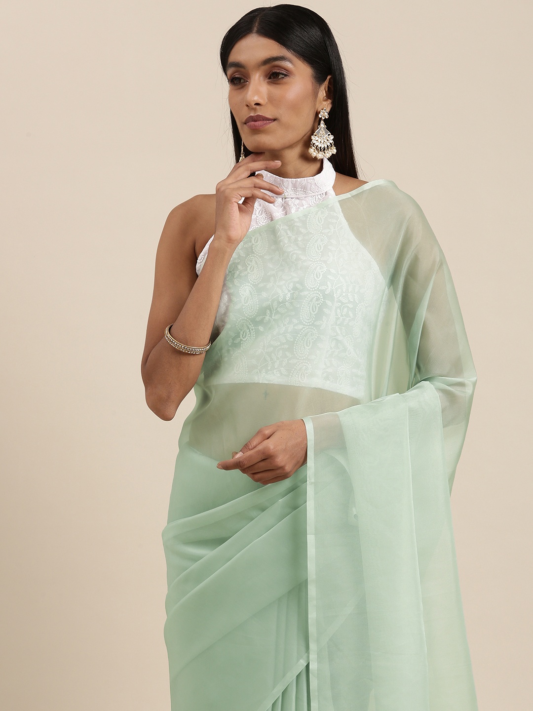 

Mitera Mint Green Solid Organza Saree