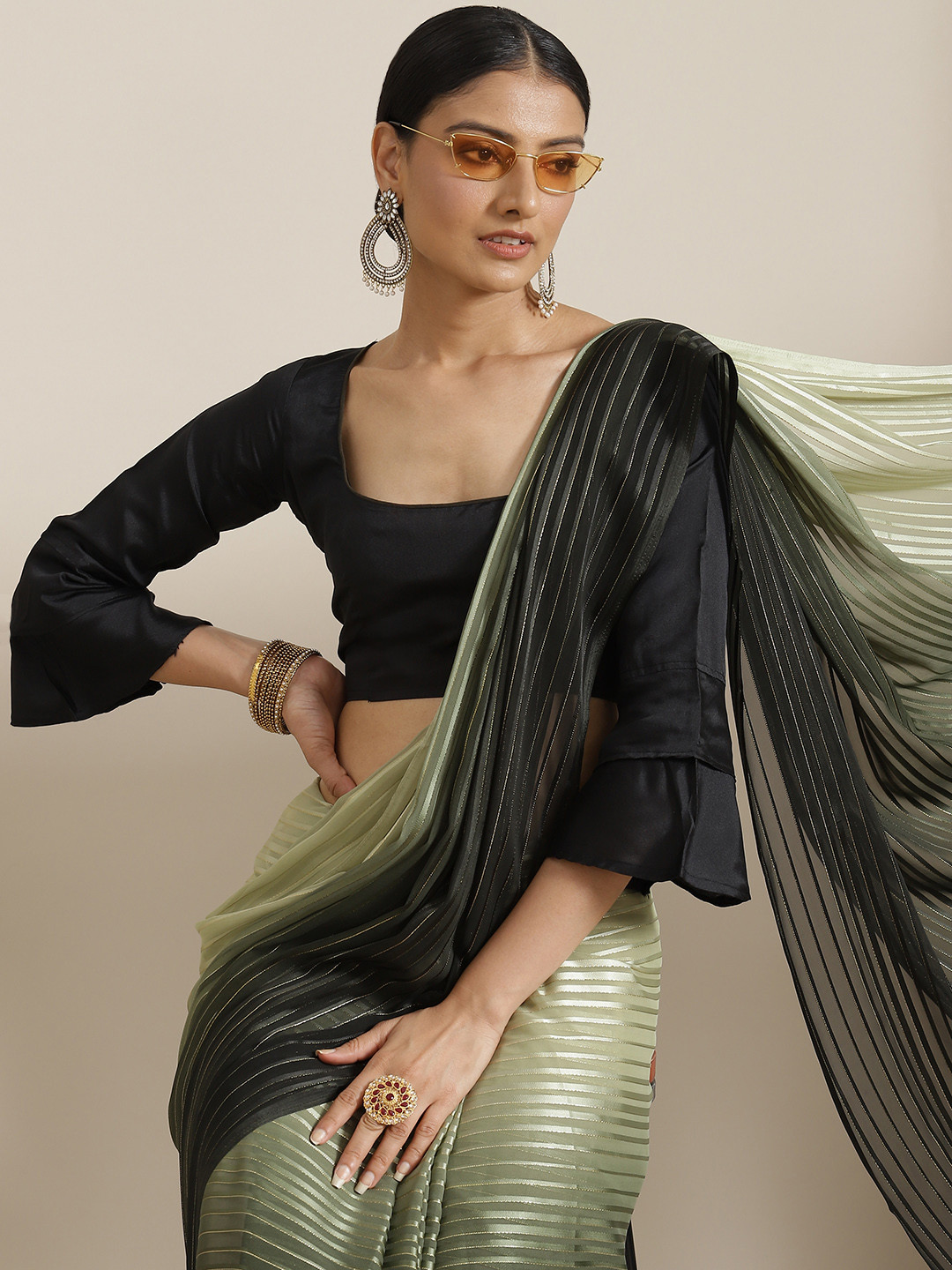 

Mitera Green & Black Self Striped Zari Saree