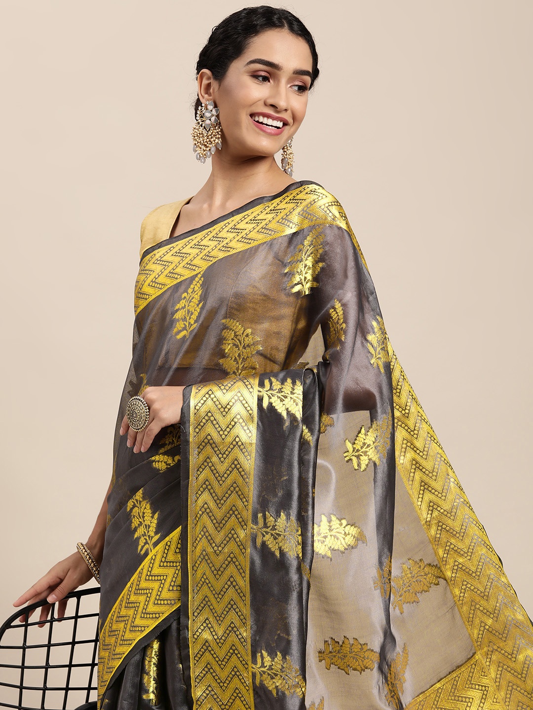 

Mitera Charcoal & Gold-Toned Ethnic Motifs Zari Organza Saree