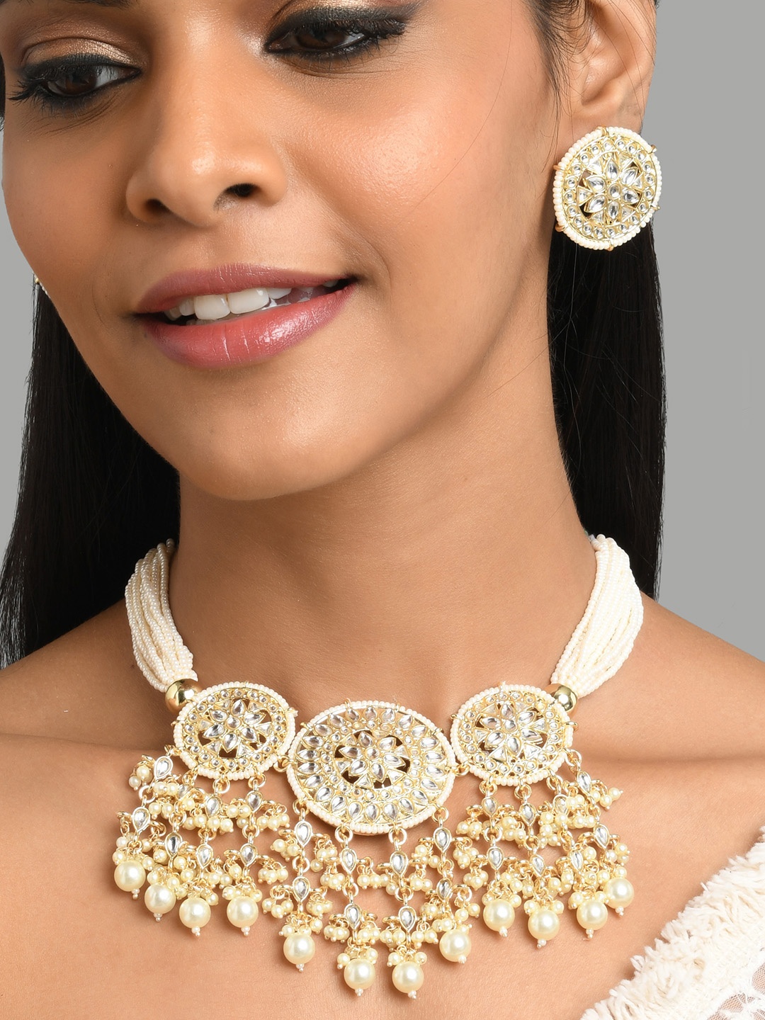 

Fida Gold-Plated White Kundan-Studded & Pearl Beaded Jewellery Set