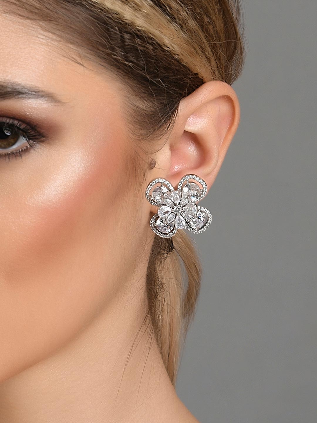 

Fida White & Silver-Toned Rhodium-Plated Floral American Diamond Studded Earrings