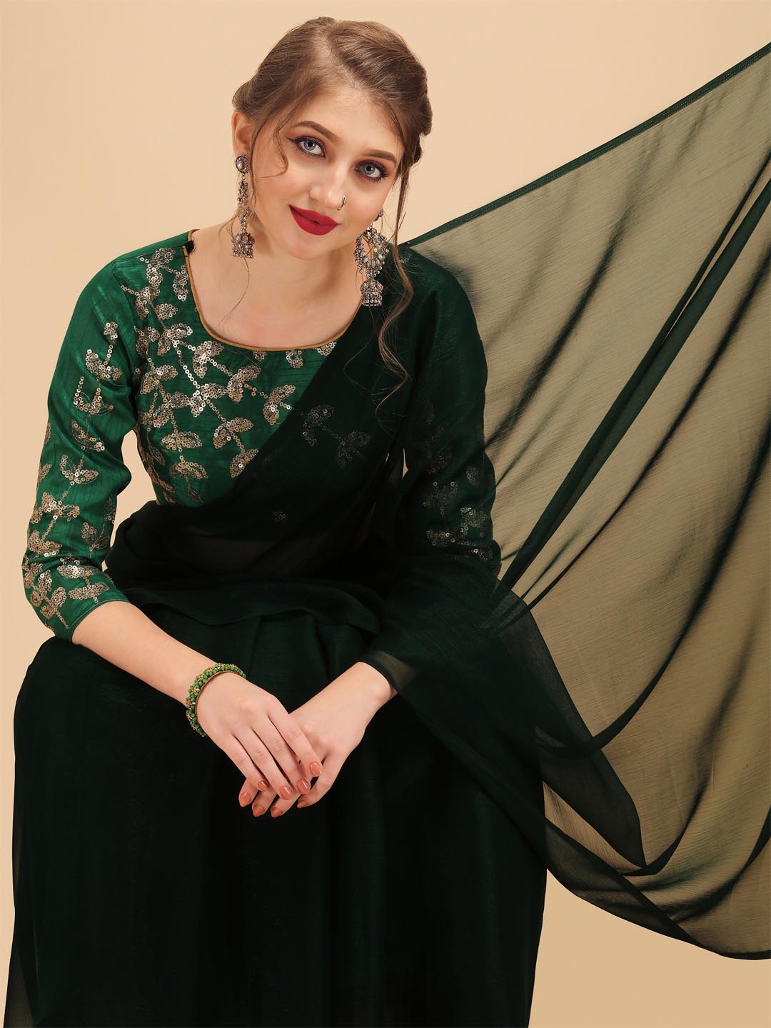 

Sangria Green Sequinned Saree