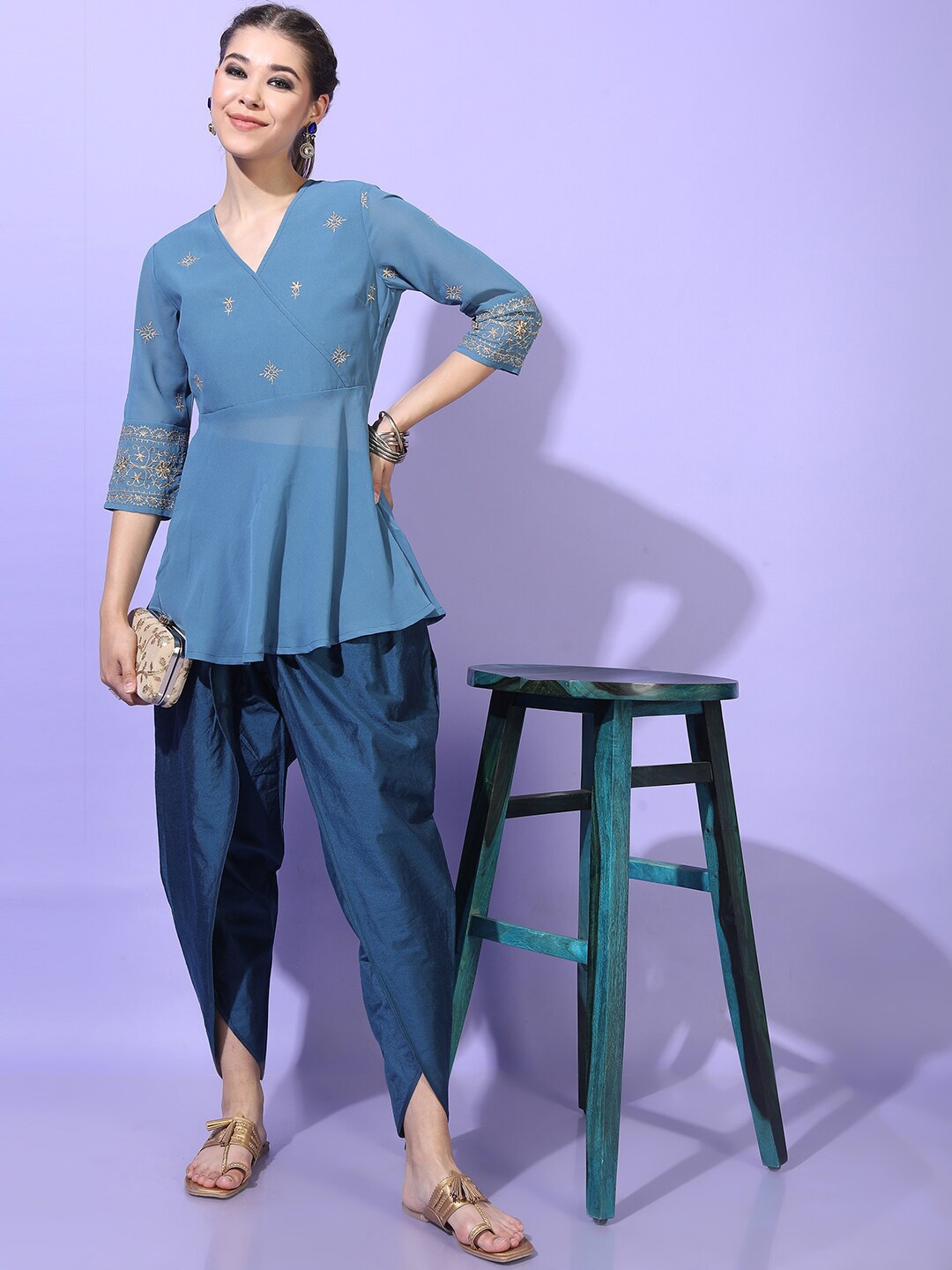 

Vishudh Women Teal Ethnic Motifs Embroidered Angrakha Kurti with Dhoti Pants