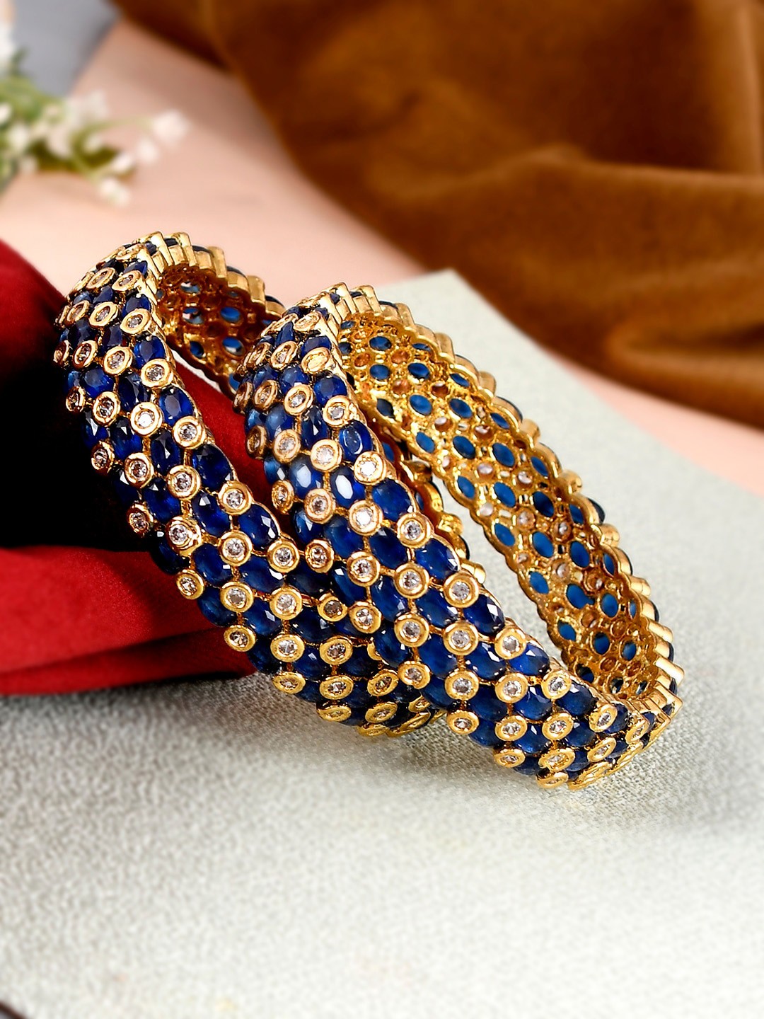 

Silvermerc Designs Set of 2 Gold Plated Blue AD Studded Handcrafted Bangles