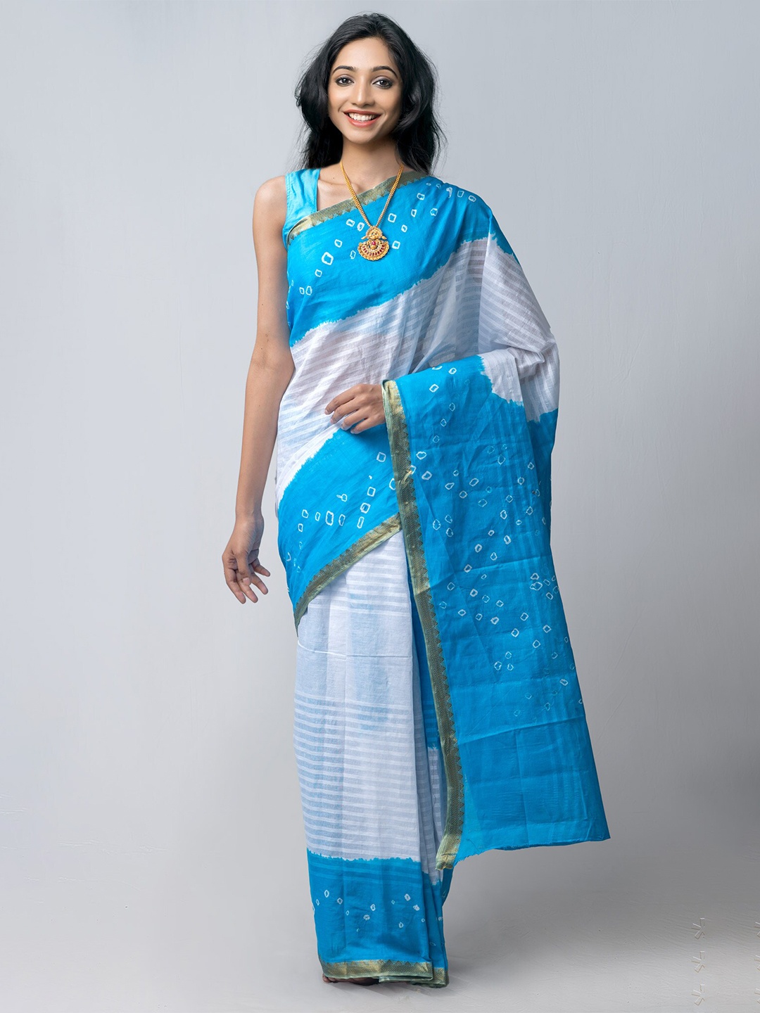 

Unnati Silks White & Blue Striped Handloom Sustainable Pure Cotton Bandhani Saree