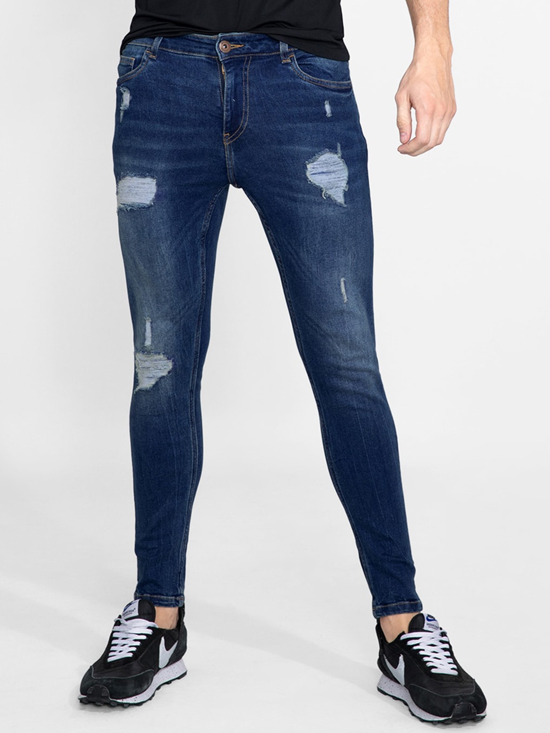 

Snitch Men Blue Skinny Fit Mildly Distressed Light Fade Stretchable Washed Denim Jeans